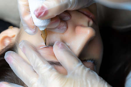 cotton swabs remove excess pigment from the eyelashes andの写真素材