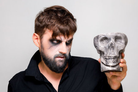 a man with a beard and makeup for Halloween grimacedの写真素材