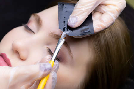 close-up of the models' eyebrows before the eyebrow lamination procedure