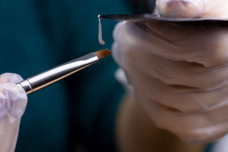 macro photography of the distribution of eyebrow hairs using a brush for laying out before the eyebrow lamination procedureの写真素材
