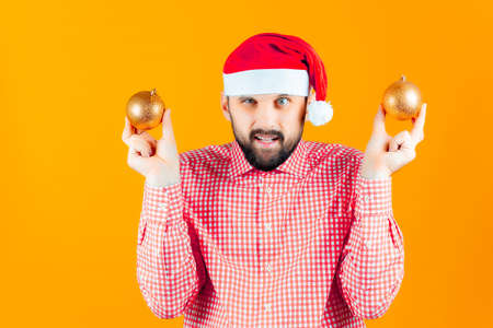 cheerful man in a santa claus hat makes christmas selfiesの写真素材