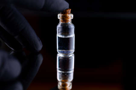 on the glass there is a bottle of argan oil that is applied to the eyebrows to soften the skin