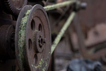 gears rollers of an old rusty motor on the farmyardの写真素材