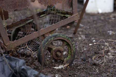 an old rusty wheelbarrow wheelbarrow on the farmの写真素材