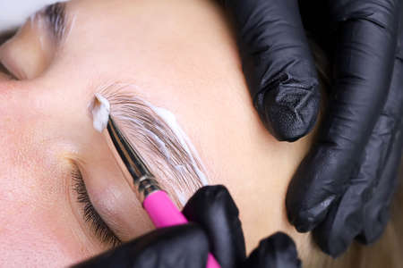 close-up of eyebrow hairs styled and combined with laminating compositionsの写真素材