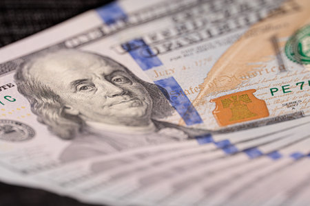 Macrophotographs of the $100 bill. Dollar bills sticking out of your pocket.の写真素材