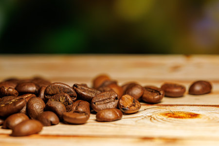 Coffee beans on the board. Coffee beans on the table.