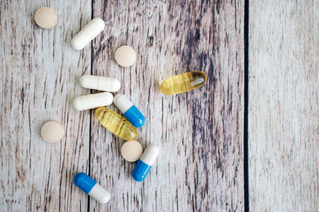 Close-up of tablet and capsule, nutritional supplements and vitamins.