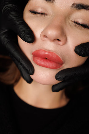 High-resolution image of precisely shaped lips and clear, natural surrounding skin.の写真素材