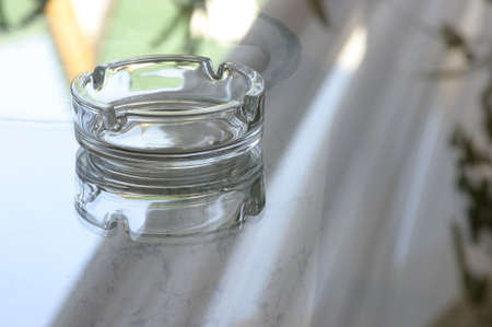 ash-tray on a glass tableの写真素材