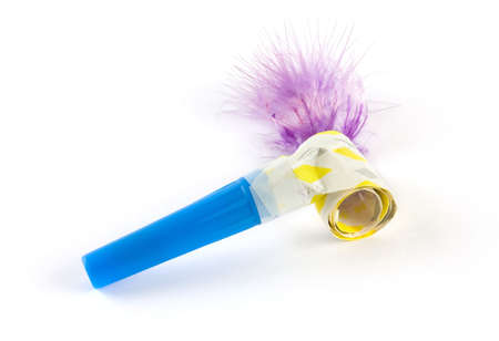 Party colorful whistle shot over white background