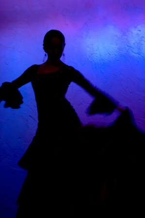 Flamenco dancer silhoete over blue backgroundの写真素材