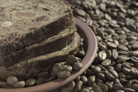 Morning snack with toastes and coffee beansの写真素材