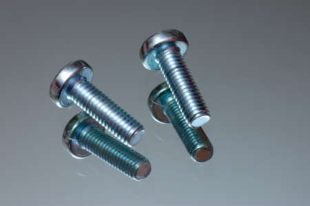 Scew on a reflecting surfaceの写真素材