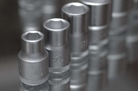 Flare nut wrench set on a reflecting surface