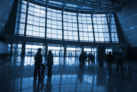People silhouettes at airport building