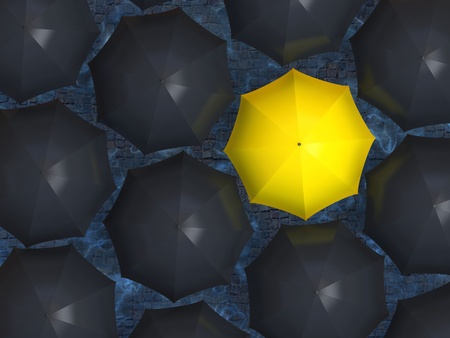 Bright yellow umbrella among set of black umbrellas の写真素材