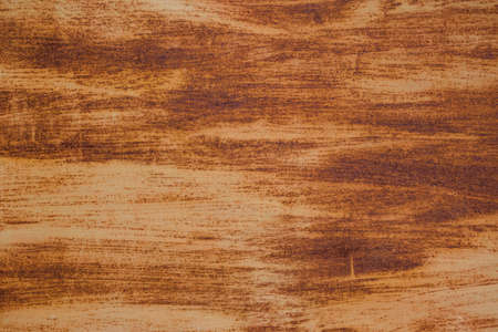 Rusty metal plate surface. Texture of a rusty metal surface with remains of white paint applied with...