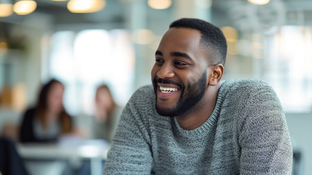 Cheerful African American Man in Casual Sweater Enjoying the Momentの素材