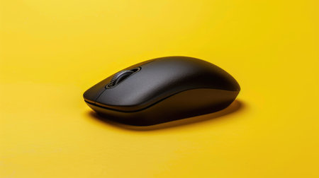 Computer mouse isolated on the yellow backgroundの素材