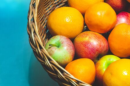 fruit basket with apples and oranges