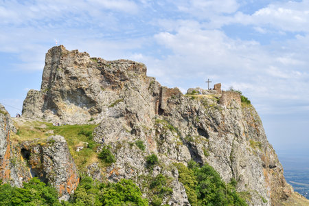 Ruins of medieval castle on the top of the mountain.の写真素材