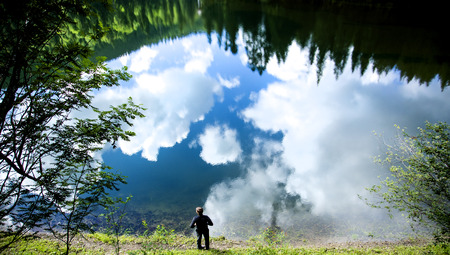 sky reflection in water lake in the mountainsの写真素材