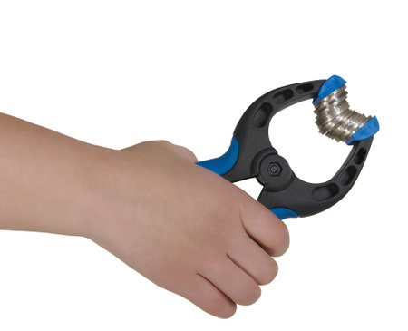 A hand holding blue clamp with coins at white backgroundの写真素材