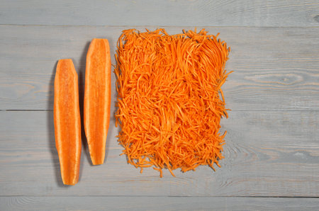 juicy carrot on grey wooden table, view from above. orange and grayの写真素材