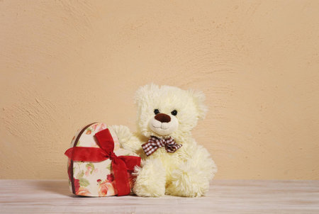 Teddy Bears on wooden table. Valentines Day background. Love heart.の写真素材
