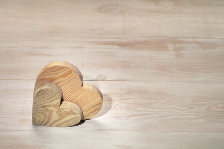 couple of wooden hearts on an table. Valentine's day background. wedding hearts.の写真素材