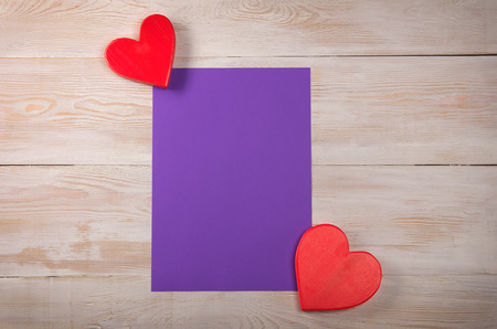 red heart. valentines day message. purple sheet of paperの写真素材