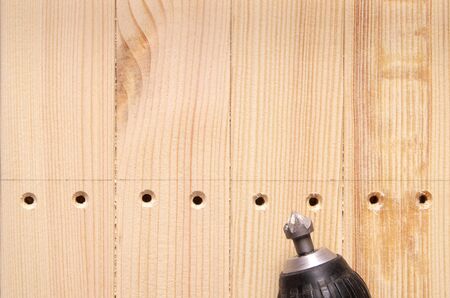 countersink bit in the drill holes machined countersink in wooden workpieces. furniture manufacturingの写真素材