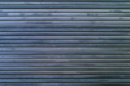 background from steel pipes. shaped steel pipes. several metal pipes lie side by side. lines created...