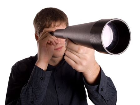 man looking through a telescope isolated on a white backgroundの写真素材