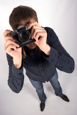 man looking at you through the cameraの写真素材