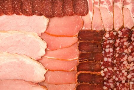 background of sliced sausage and meatの写真素材