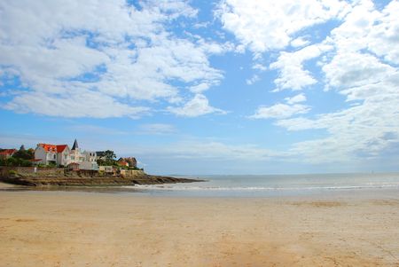 empty beach with a beautiful house and overlooking the seaの写真素材
