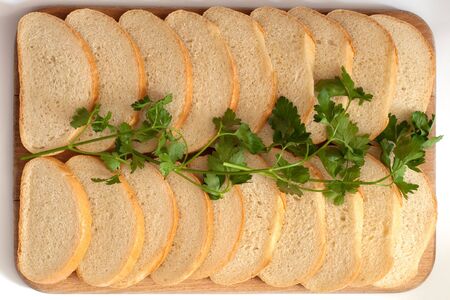 cutting bread on a boardの写真素材