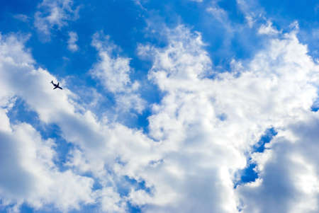 plane in the sky with a lot of clouds