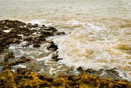 background of ocean waves with rocksの写真素材