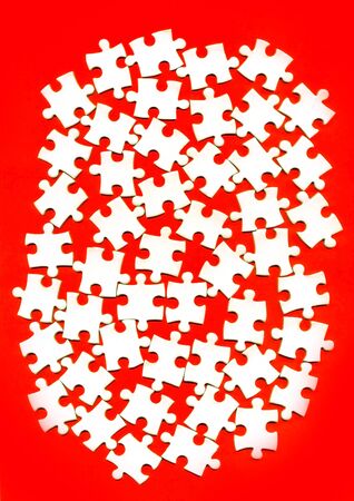 puzzle pieces on a red backgroundの写真素材