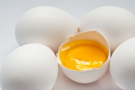 eggs with yolk on a grey backgroundの写真素材