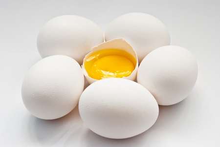 eggs with yolk on a grey backgroundの写真素材