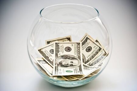 heap of dollars in a bottleの写真素材