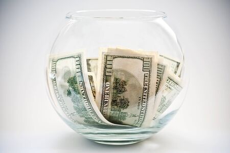 heap of dollars in a bottleの写真素材