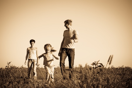 happy family in a meadowの写真素材