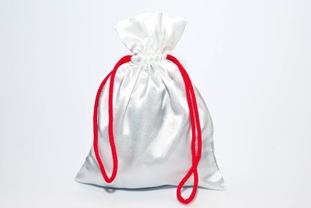 gift bag with red ribbonの写真素材