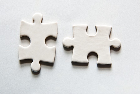 two puzzle pieces on a grey backgroundの写真素材