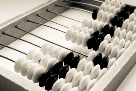 old abacus closeup on a grey background